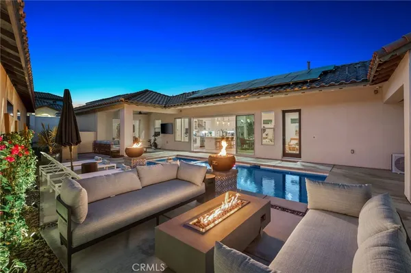 a living room with furniture and a rug
