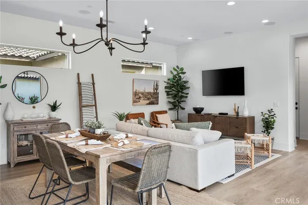 a view of a dining room with furniture and a mirror