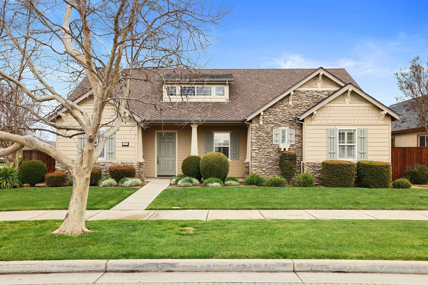 377 Travertine Drive Ripon, CA 95366 - Photo 1 of 1 a front view of a house with a yard and garage