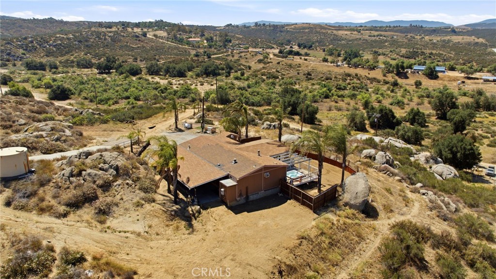 40100 Owl Valley Road Temecula, CA 92592 - Photo 8 of 44 an aerial view of a house with a mountain