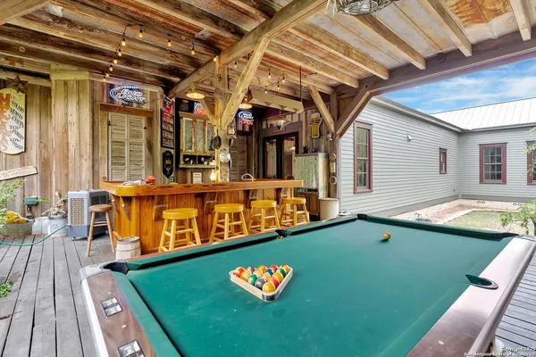 a view of swimming pool with outdoor seating