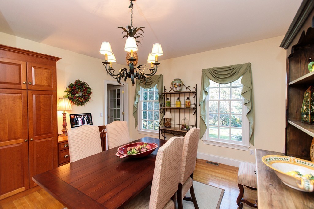 8 Cushing Road Wellesley, MA 02481 - Photo 5 of 17 a view of a dining room with furniture a chandelier and wooden floor