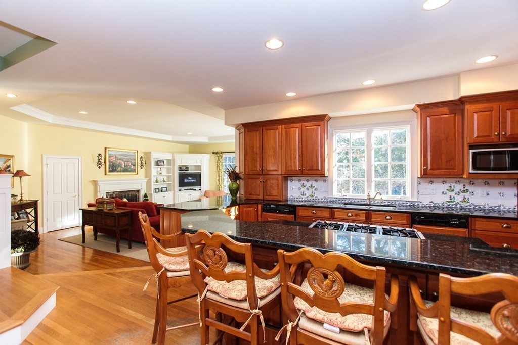 8 Cushing Road Wellesley, MA 02481 - Photo 7 of 17 a large dining hall with stainless steel appliances granite countertop a stove and a dining table chair