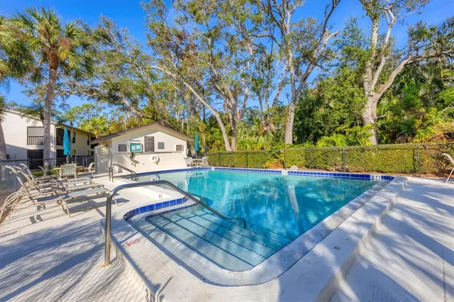 a view of a backyard with sitting area