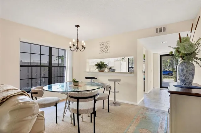 a view of a dining room with furniture and window
