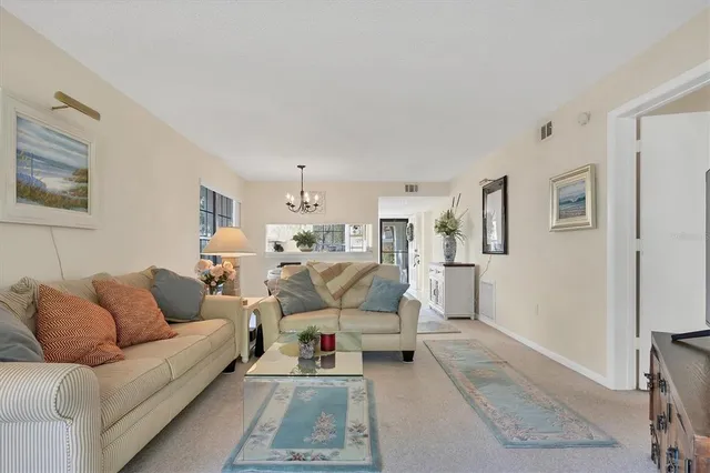 a living room with furniture white walls and white walls