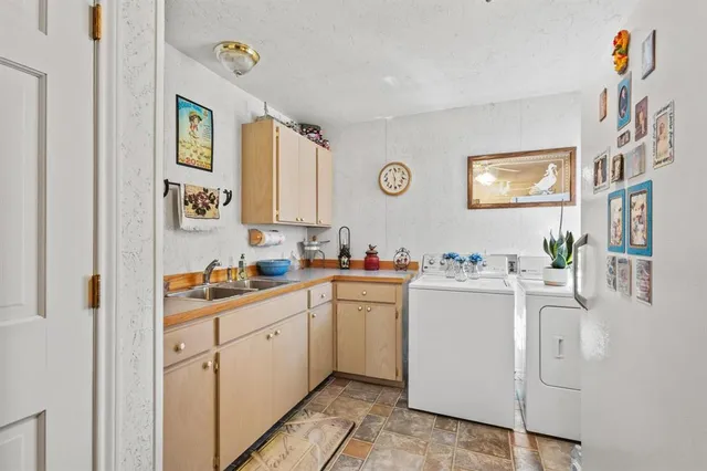a kitchen with cabinets and window