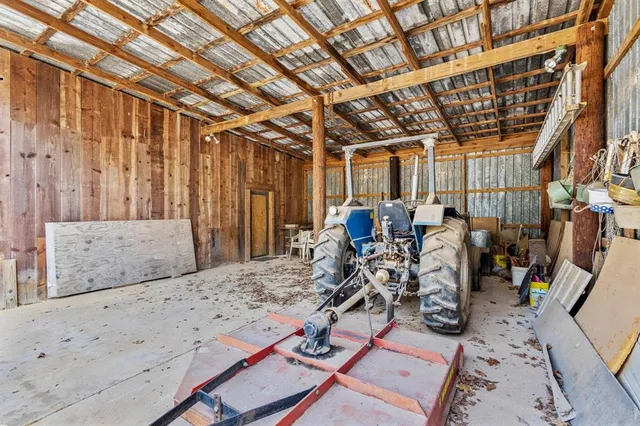 a view of a chairs and table in a patio