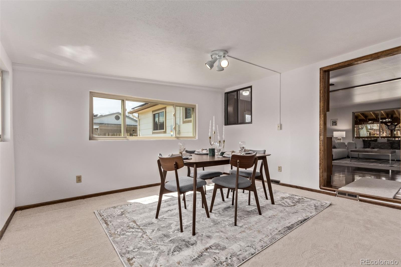 7720 Kendall Street Arvada, CO 80003 - Photo 11 of 45 a view of a dining room with furniture