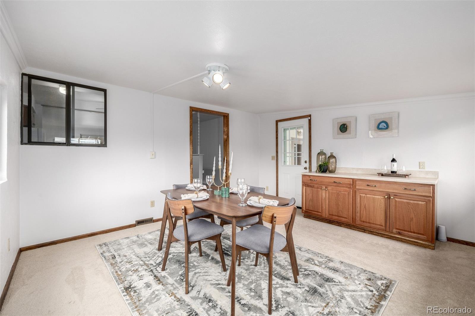 7720 Kendall Street Arvada, CO 80003 - Photo 12 of 45 a view of a dining room with furniture