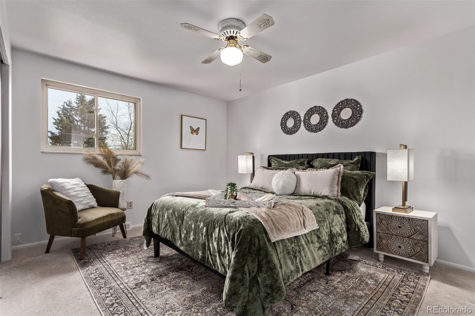 7720 Kendall Street Arvada, CO 80003 - Photo 14 of 45 a bedroom with a bed and a chandelier