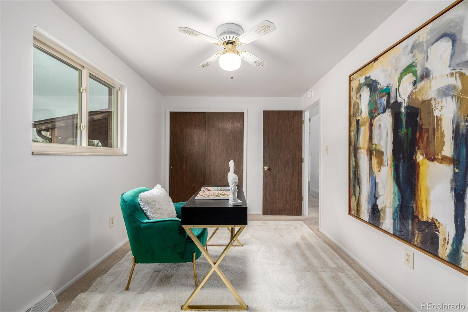 7720 Kendall Street Arvada, CO 80003 - Photo 18 of 45 a living room with furniture and a chandelier