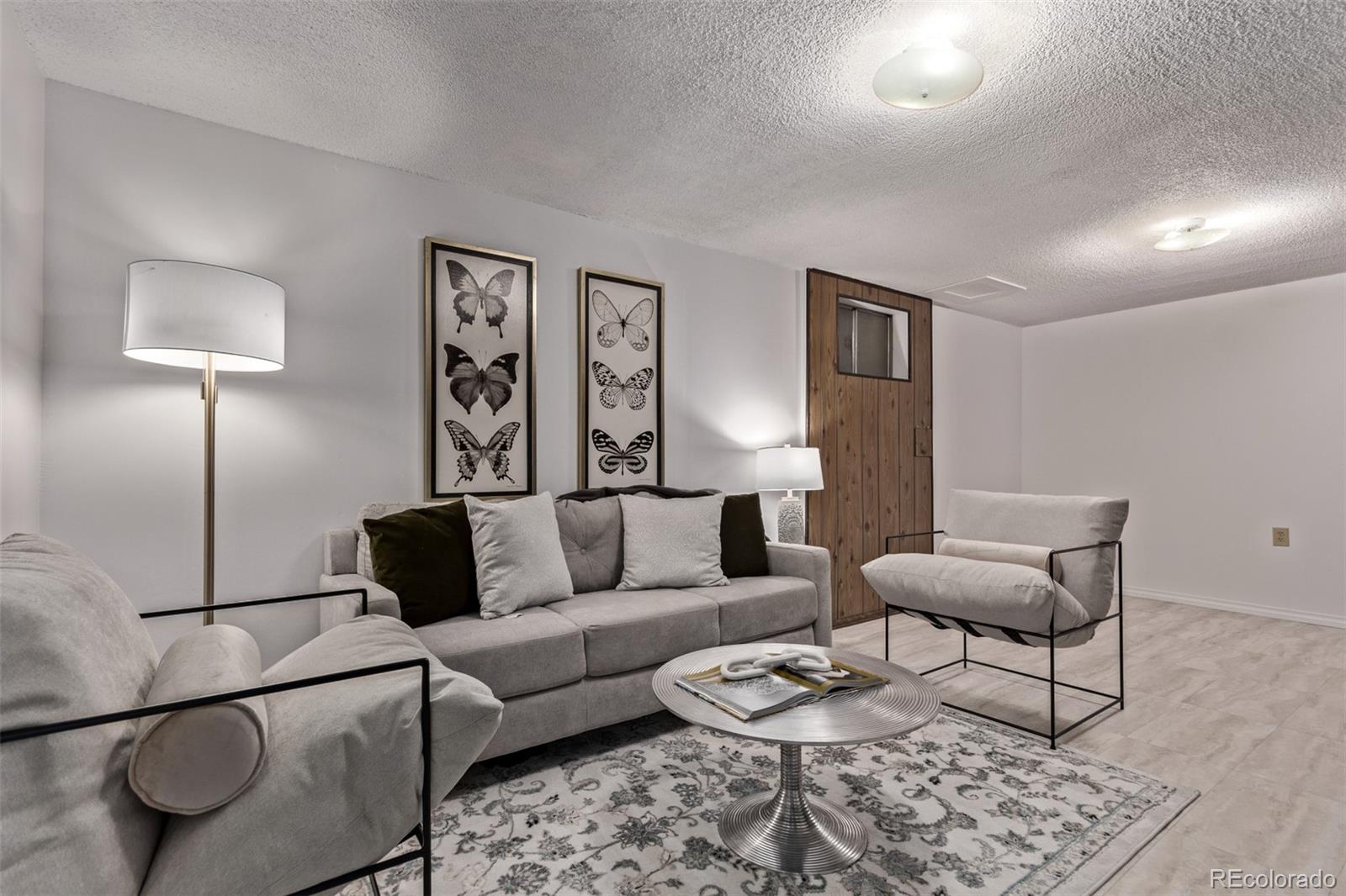 7720 Kendall Street Arvada, CO 80003 - Photo 22 of 45 a living room with furniture and wooden floor