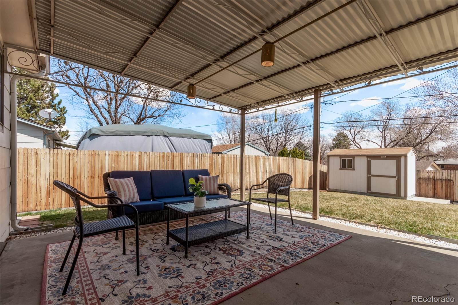 7720 Kendall Street Arvada, CO 80003 - Photo 29 of 45 a patio with patio couch and outdoor seating