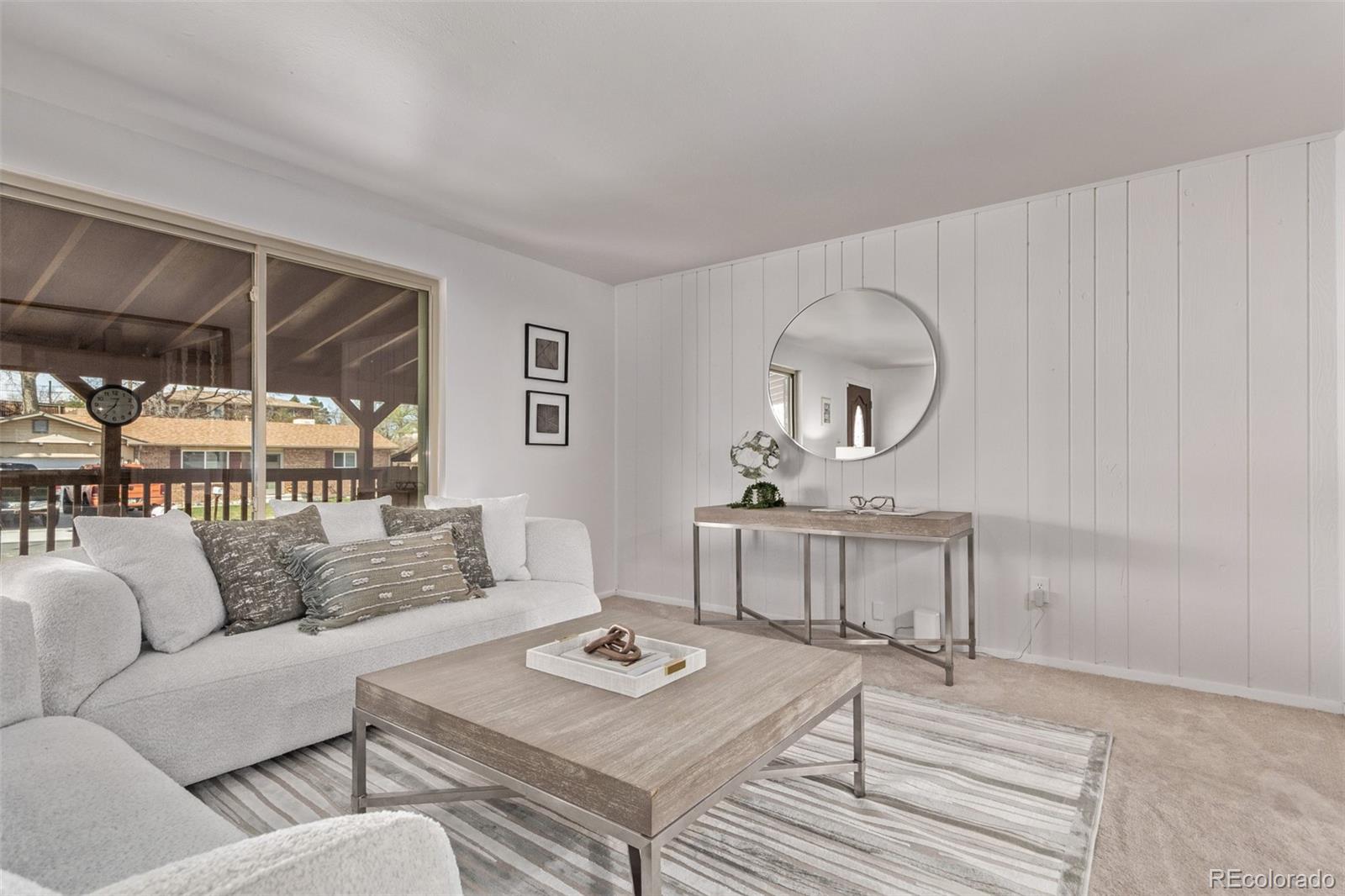 7720 Kendall Street Arvada, CO 80003 - Photo 5 of 45 a living room with furniture and a window