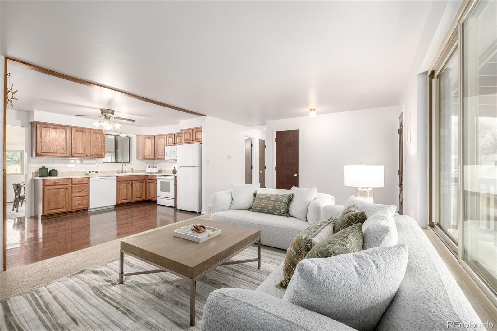 7720 Kendall Street Arvada, CO 80003 - Photo 6 of 45 a living room with furniture and view of kitchen