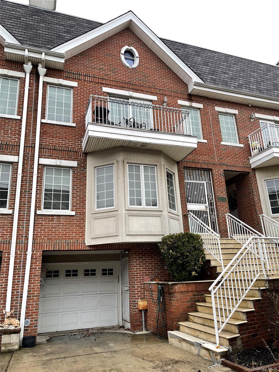 350 Soundview Lane Queens, NY 11356 - Photo 1 of 11 a front view of a house with a balcony