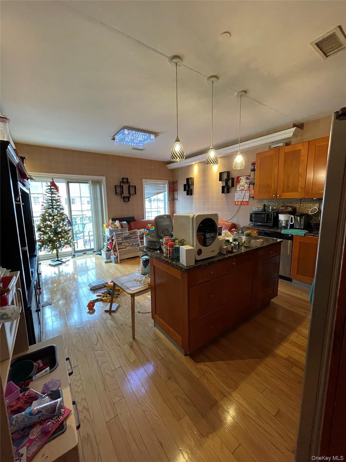 350 Soundview Lane Queens, NY 11356 - Photo 4 of 11 a living room with furniture and a flat screen tv