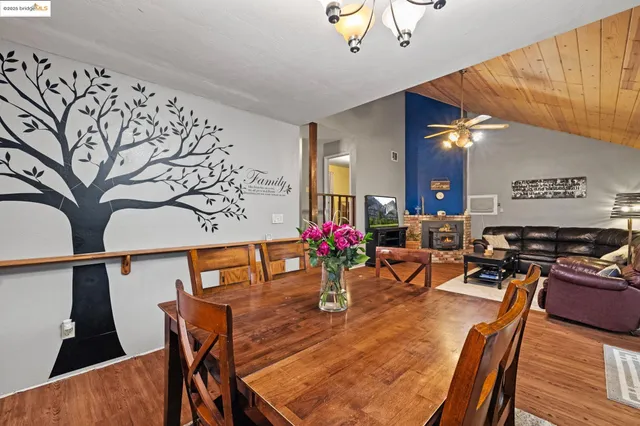 a view of a chair and tables in the balcony