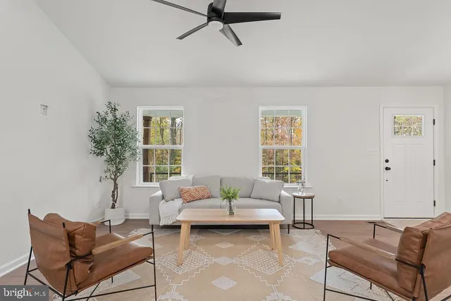 a living room with furniture and window