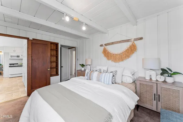 a bedroom with a bed and a cabinets