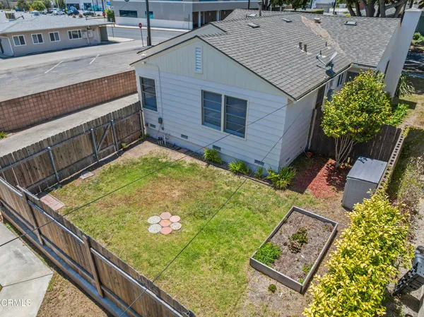 a view of a backyard with sitting area