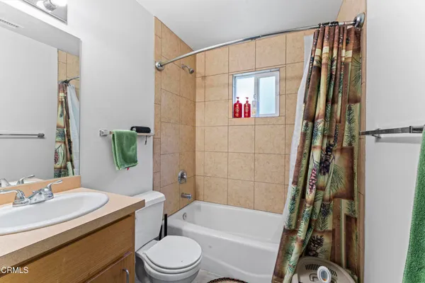 a kitchen with stainless steel appliances granite countertop a sink and a refrigerator