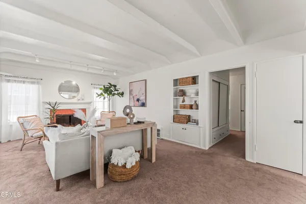 a room with furniture and white walls