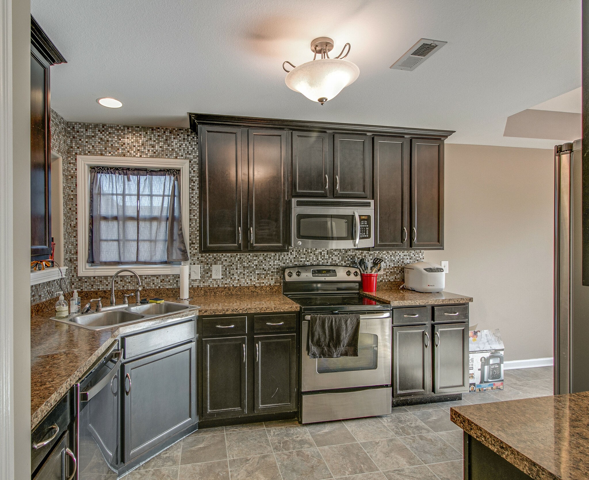 3697 Trough Springs Road Adams, TN 37010 - Photo 8 of 29 a kitchen with a stove and a sink