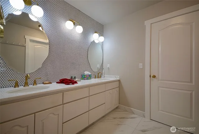 a bathroom with a sink and a mirror