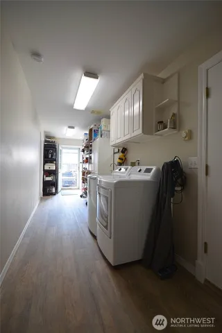 a view of a patio with table and chairs potted plants with wooden floor