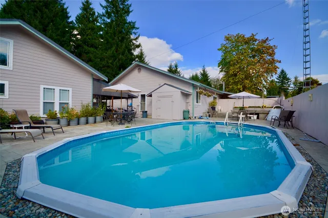a front view of house with yard and trees