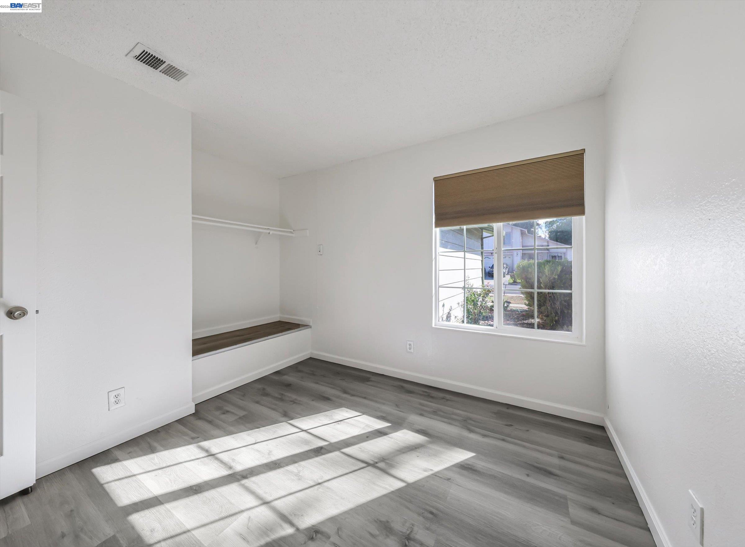 3432 Danielle Place Bay Point, CA 94565 - Photo 17 of 36 an empty room with wooden floor and windows