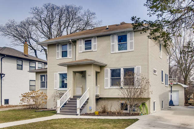 126 Southcote Road Riverside, IL 60546 - Photo 2 of 31 a front view of a house with a yard
