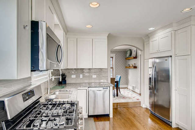 126 Southcote Road Riverside, IL 60546 - Photo 11 of 31 a kitchen with stainless steel appliances granite countertop a refrigerator and a stove top oven