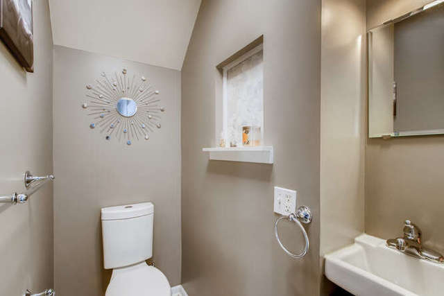 126 Southcote Road Riverside, IL 60546 - Photo 12 of 31 a white toilet sitting next to a bathroom sink