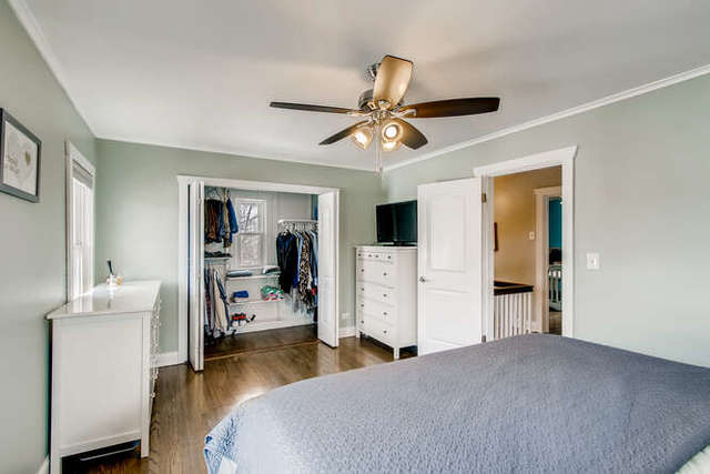 126 Southcote Road Riverside, IL 60546 - Photo 13 of 31 a bedroom with bed and a chandelier
