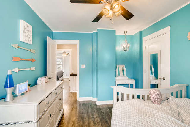 126 Southcote Road Riverside, IL 60546 - Photo 18 of 31 a bedroom with a bed and a chandelier
