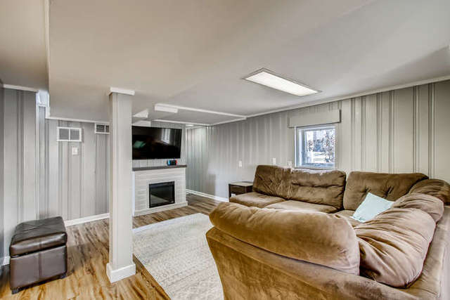 126 Southcote Road Riverside, IL 60546 - Photo 23 of 31 a living room with furniture and a flat screen tv