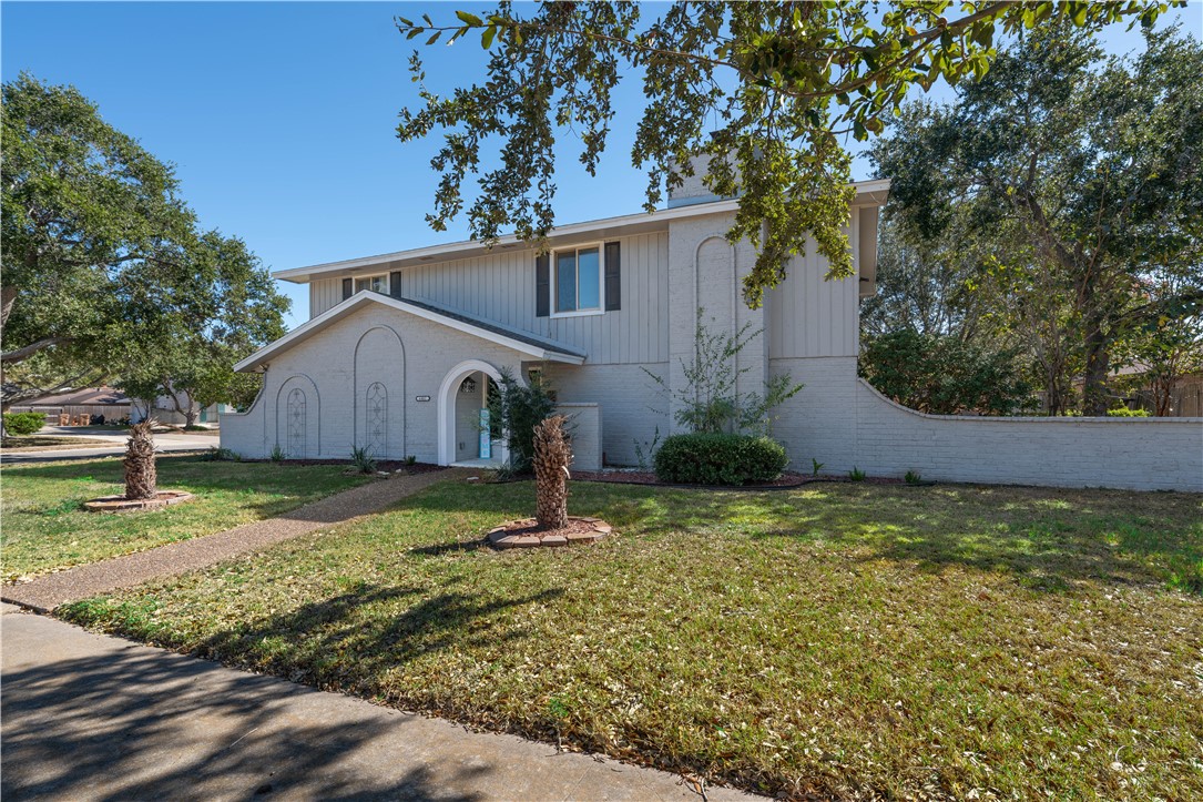 6402 Clearlake Circle Corpus Christi, TX 78413 - Photo 1 of 29 a house with garden in front of it