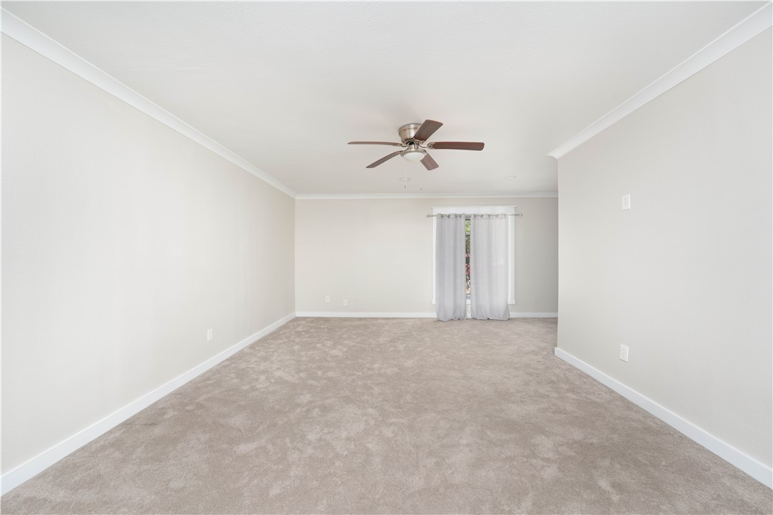6402 Clearlake Circle Corpus Christi, TX 78413 - Photo 16 of 29 a view of an empty room with a ceiling fan