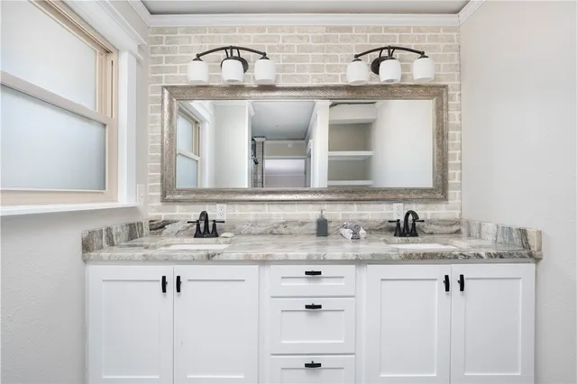 a view of a hallway with windows and stairs