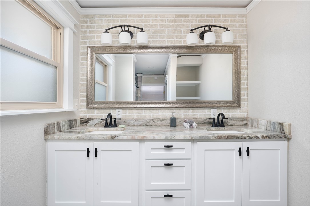 6402 Clearlake Circle Corpus Christi, TX 78413 - Photo 19 of 29 a bathroom with a sink and a mirror