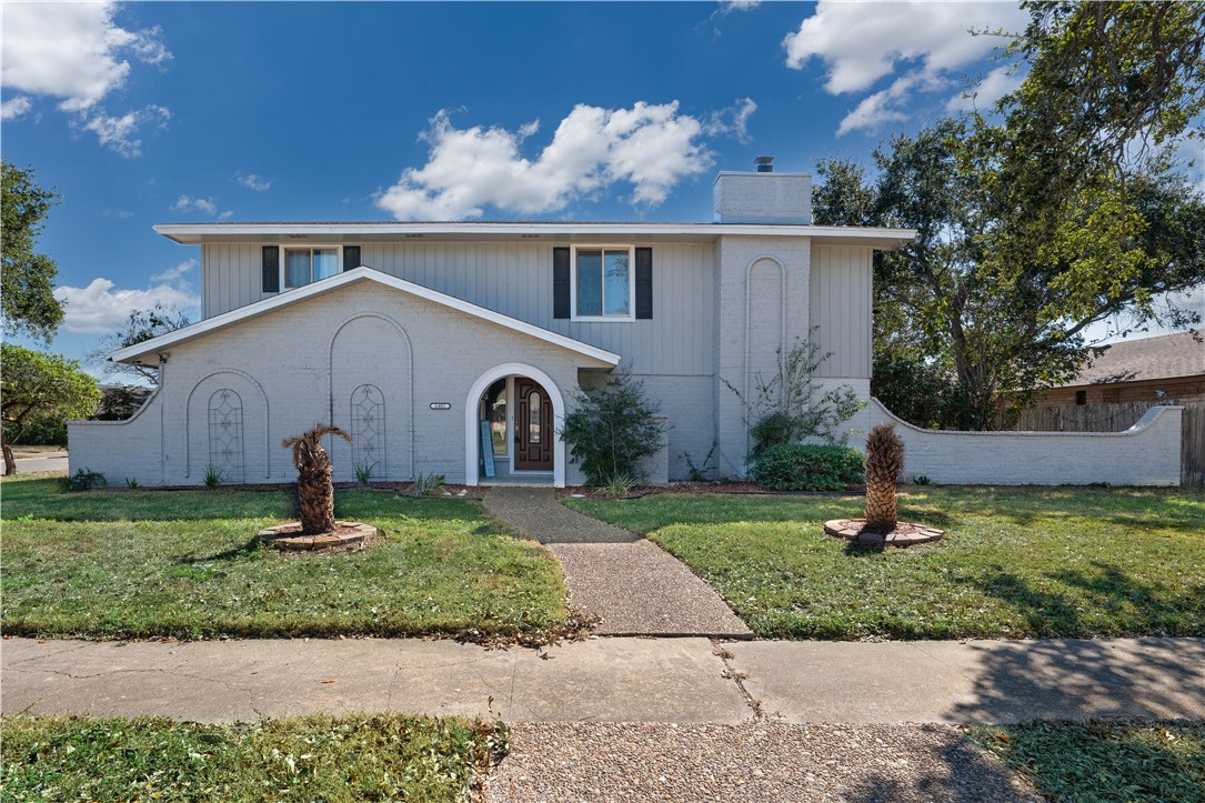 6402 Clearlake Circle Corpus Christi, TX 78413 - Photo 2 of 29 a front view of a house with garden