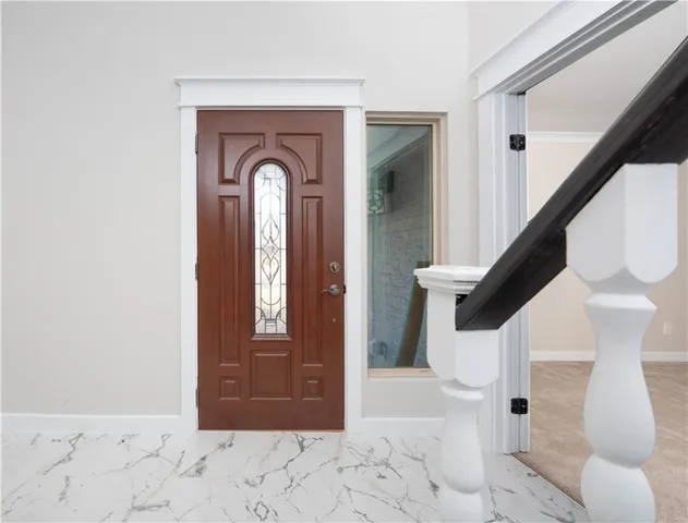 a view of entryway with a front door