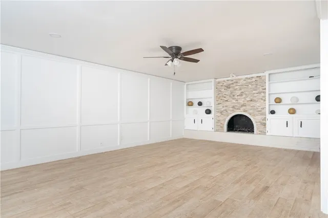 a view of kitchen with a fireplace and a chandelier