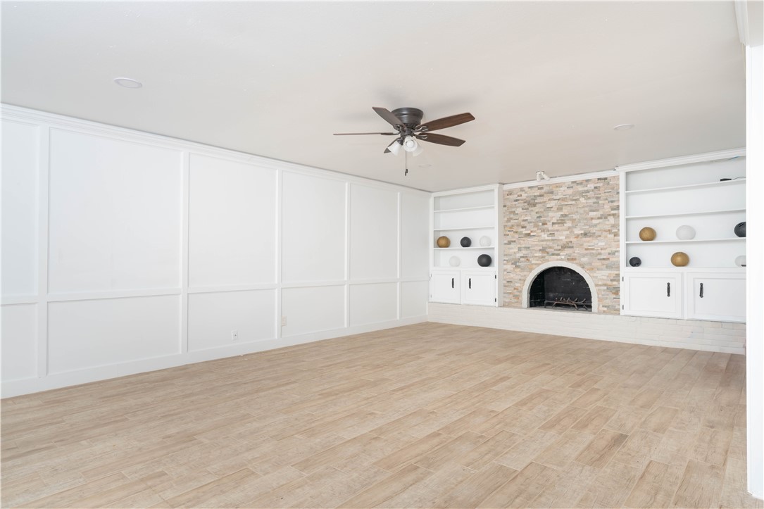 6402 Clearlake Circle Corpus Christi, TX 78413 - Photo 7 of 29 a view of kitchen with a fireplace and a chandelier