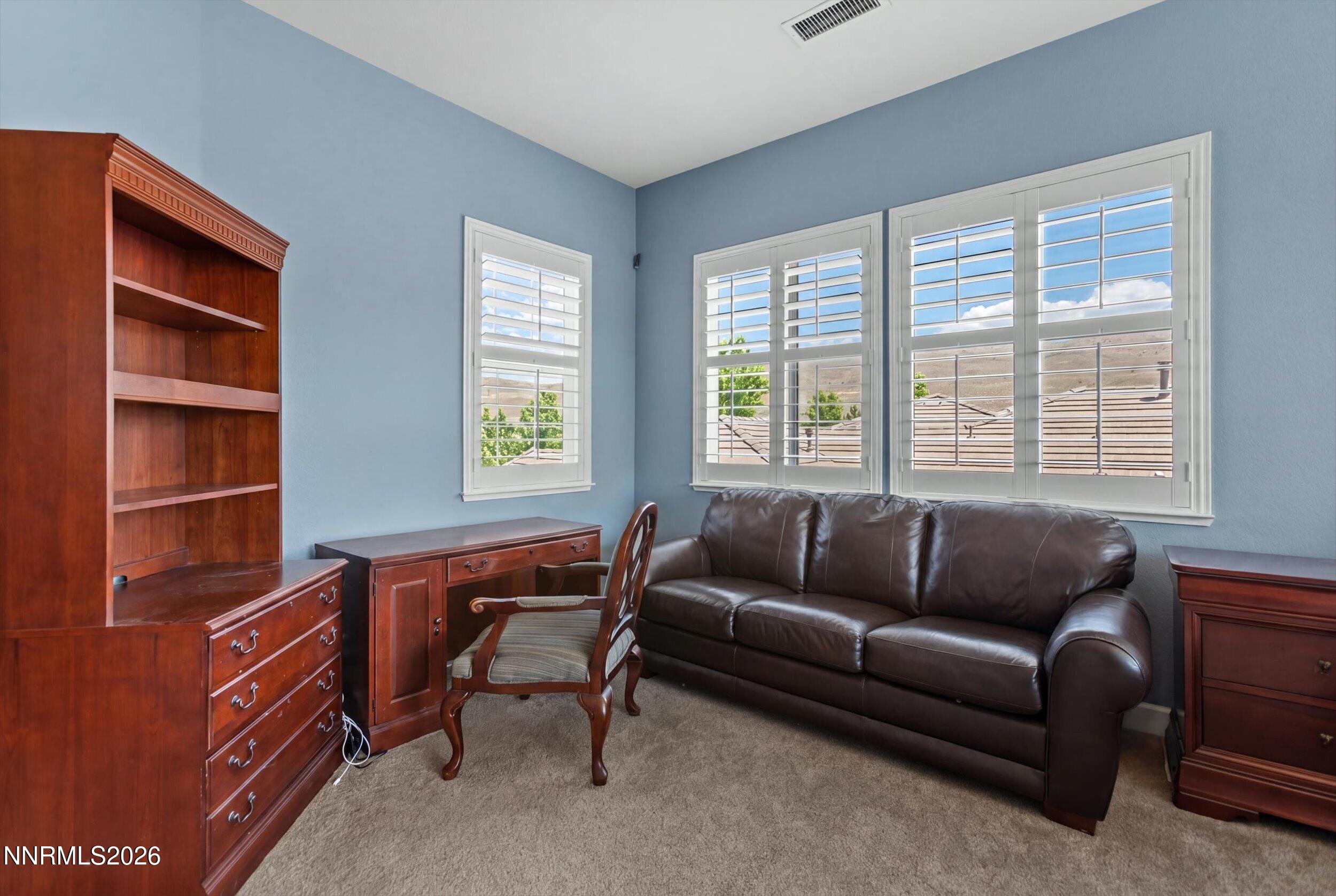 2920 Bull Rider Drive Reno, NV 89521 - Photo 34 of 51 a living room with furniture and a window