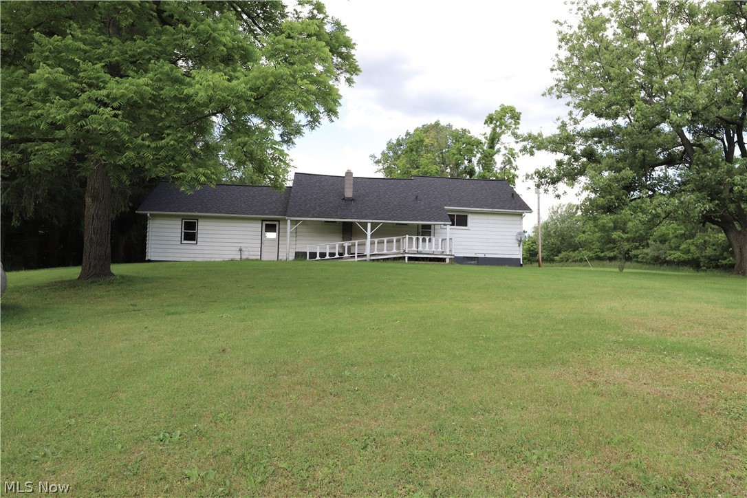1860 Ridgewood Road Wadsworth, OH 44281 - Photo 16 of 16 Back of house with a lawn