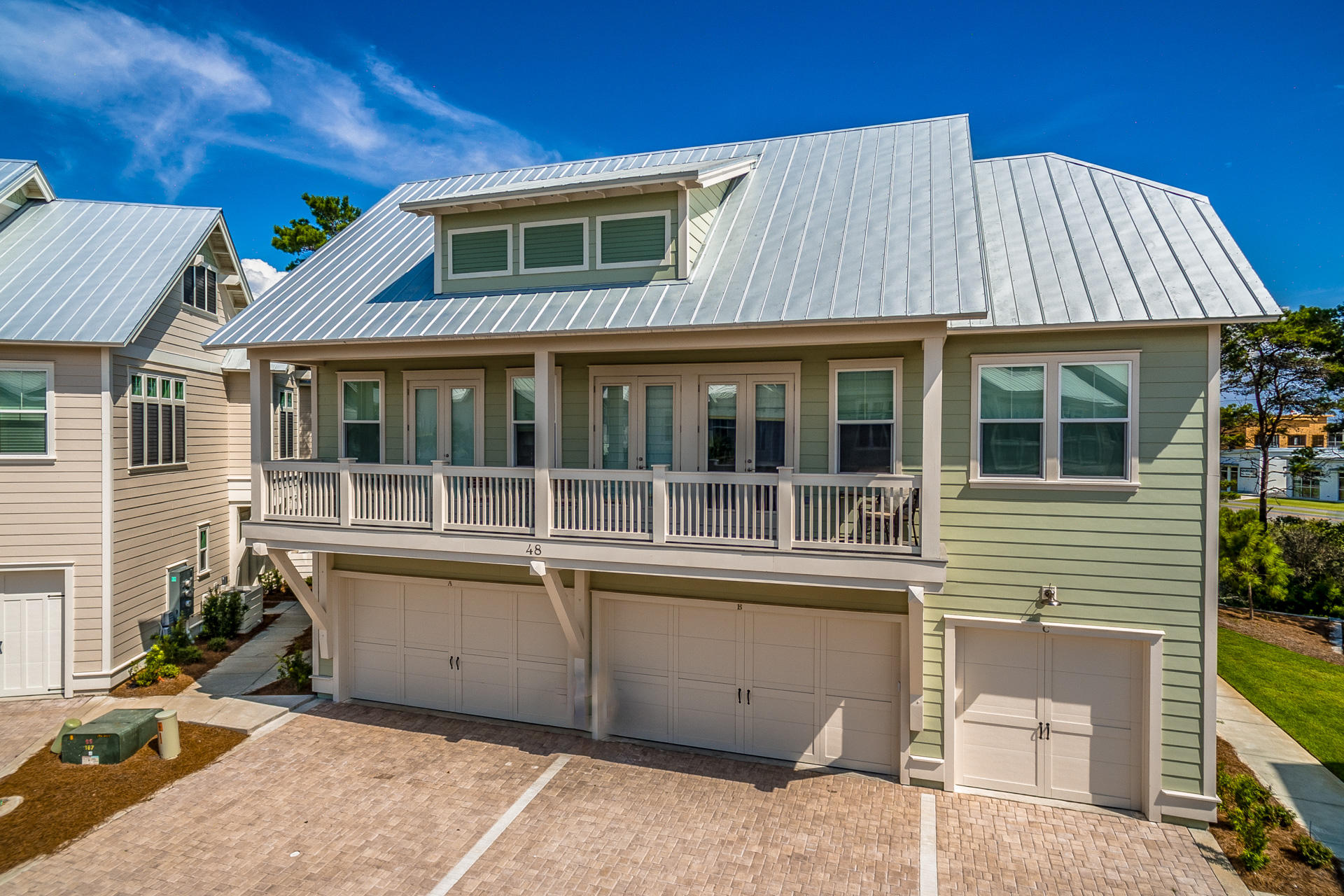 99 Pine Lands Loop Inlet Beach East, Unit A Inlet Beach, FL 32461 - Photo 1 of 30 a front view of a house with a yard